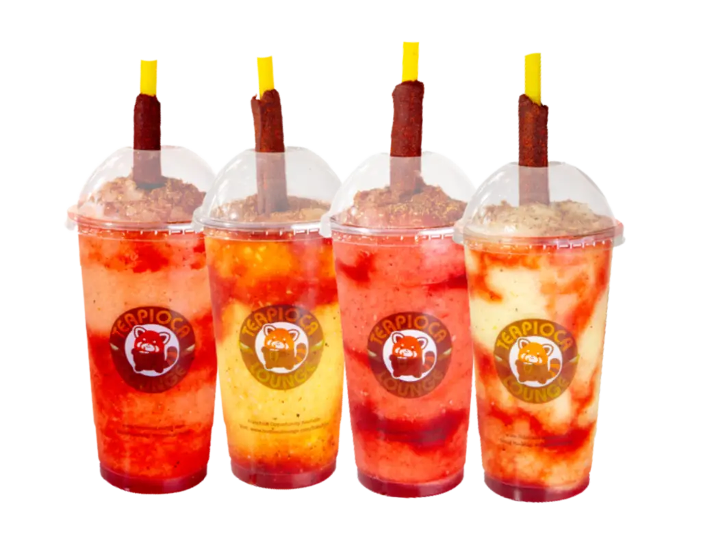 Colorful Mangonada drinks with boba from Teapioca Lounge, topped with chamoy and Tajín