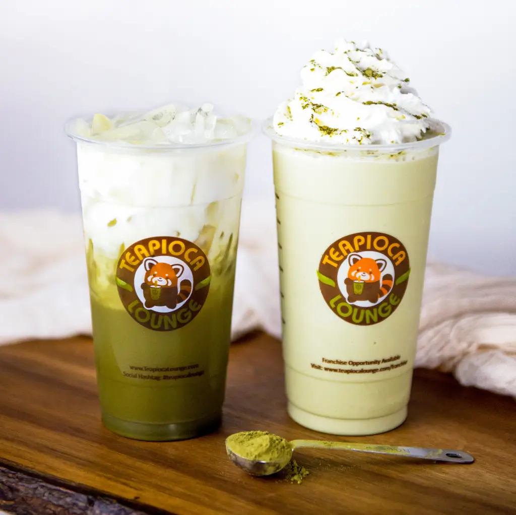 Matcha Green Tea Frappioca topped with whipped cream in a clear Teapioca Lounge cup